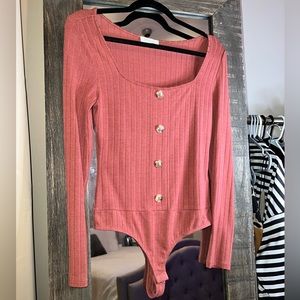 Long sleeve rust colored bodysuit